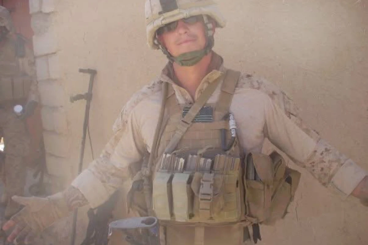 Justin Cox in full combat gear at a forward operating base in Afghanistan